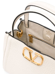 Sacs Valentino Garavani. Petit sac à main beige