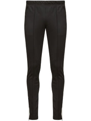 Pantalon Maison Margiela noir avec détails à rayures