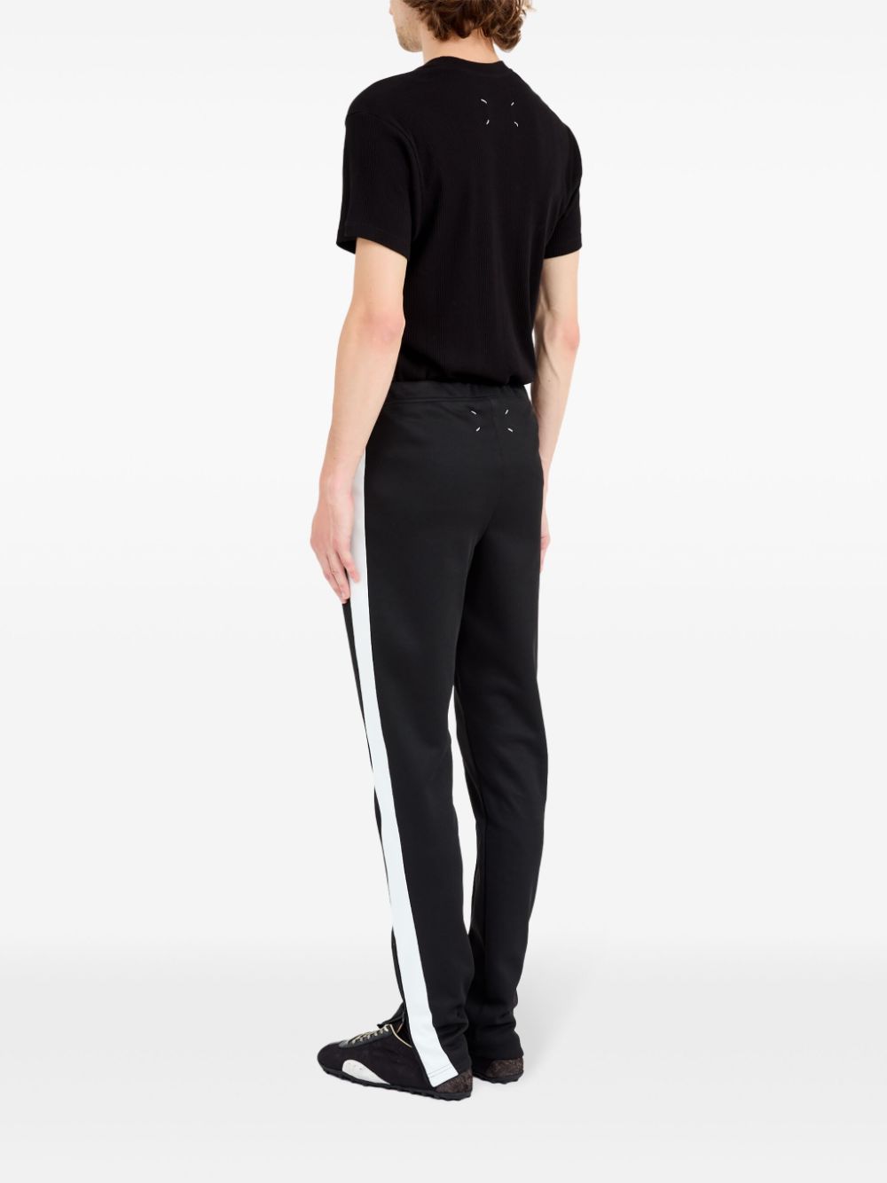 Pantalon Maison Margiela noir avec détails à rayures
