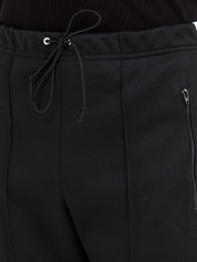 Pantalon Maison Margiela noir avec détails à rayures
