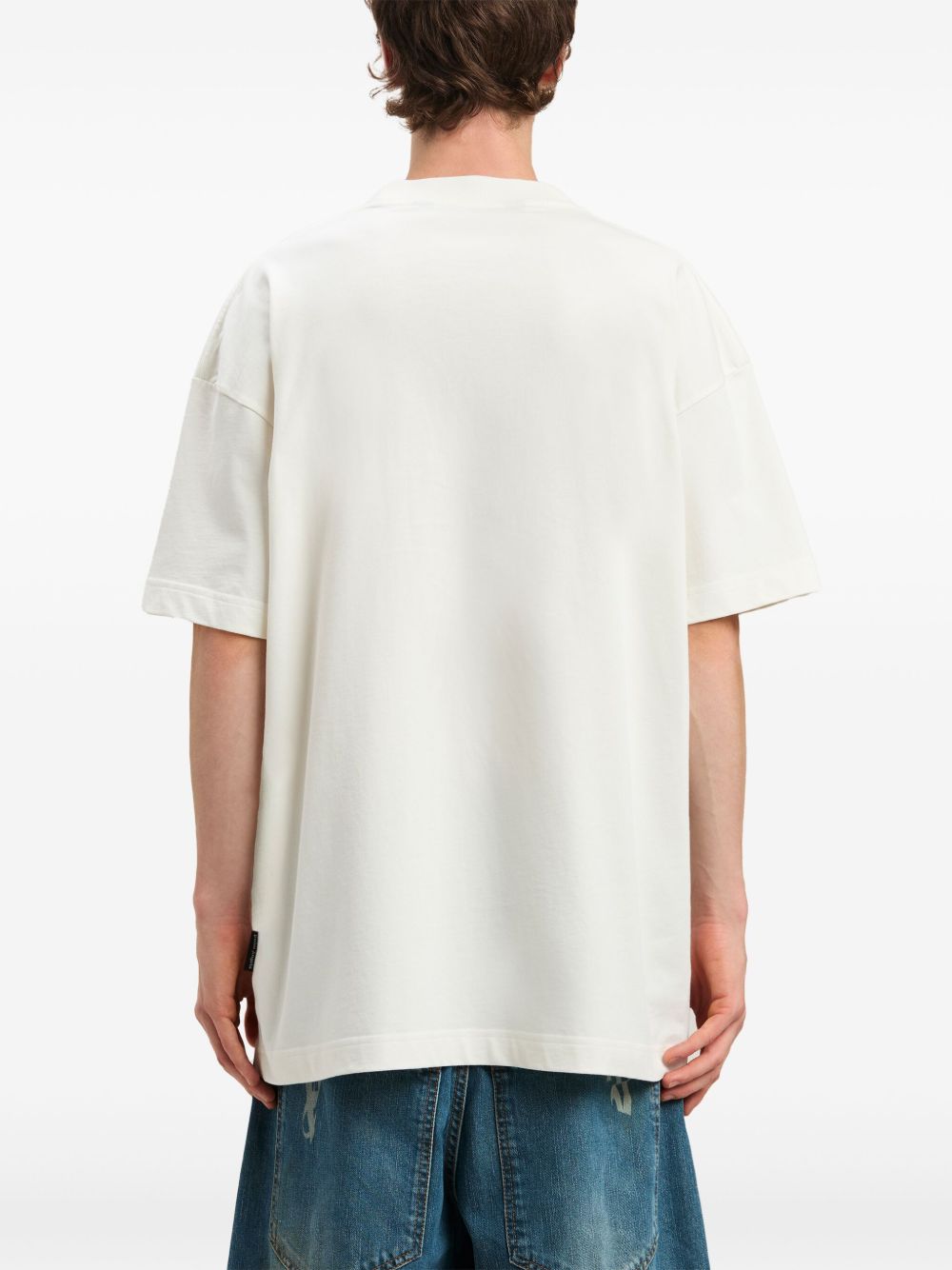 Rear view of Palm Angels white logo T-shirt, crew neck, drop shoulder design.