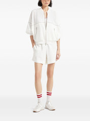 Top Brunello Cucinelli de algodón blanco acanalado con ribete en contraste