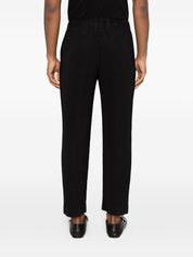 HOMME PLISSE' ISSEY MIYAKE Trousers — Black, Pleated