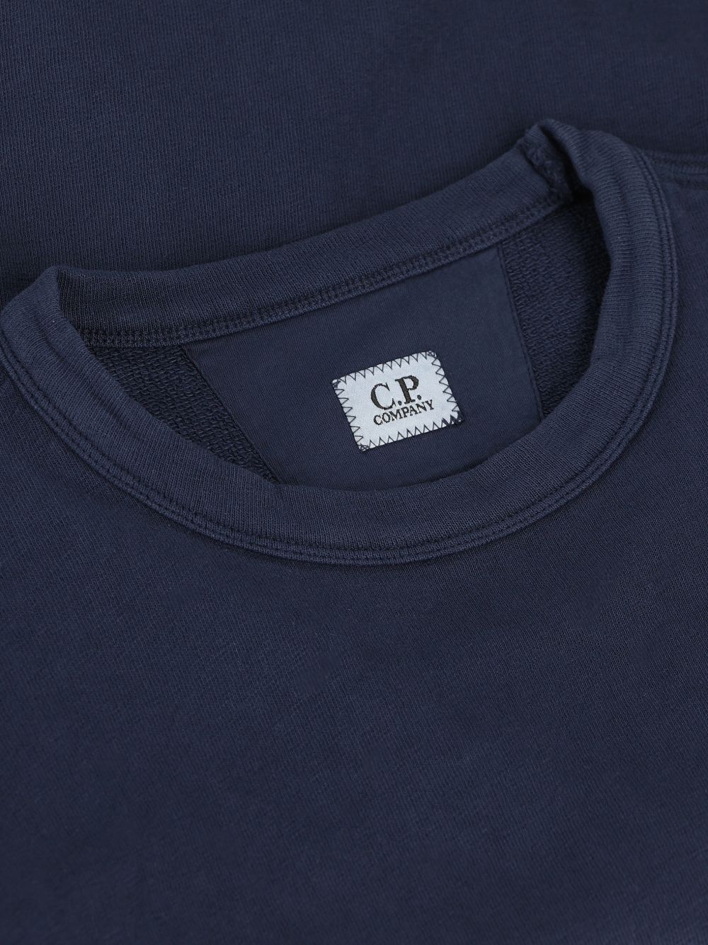 C.P. Company Blue Sweater — Round Neck Lens Detail