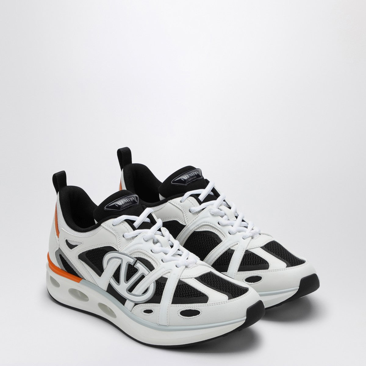 Valentino Garavani Vlogo Easyjog sneakers in white, black and orange leather