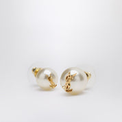 Boucles d'oreilles asymétriques Saint Laurent avec perle et logo Cassandre