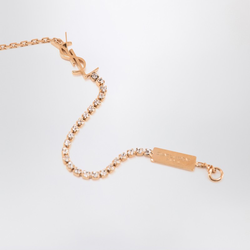 Bracelet à breloques Cassandre Saint Laurent en laiton doré