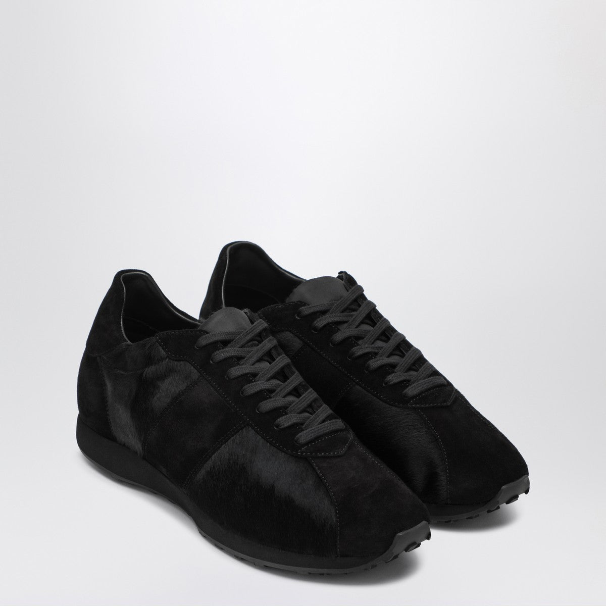 The Row Black sneaker in pony and velvet
