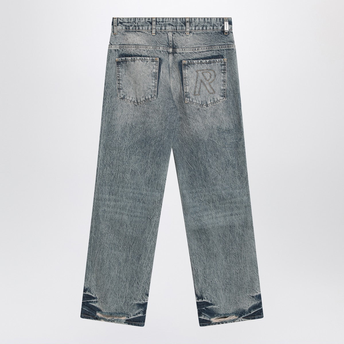 Represent Washed blue jeans with rips