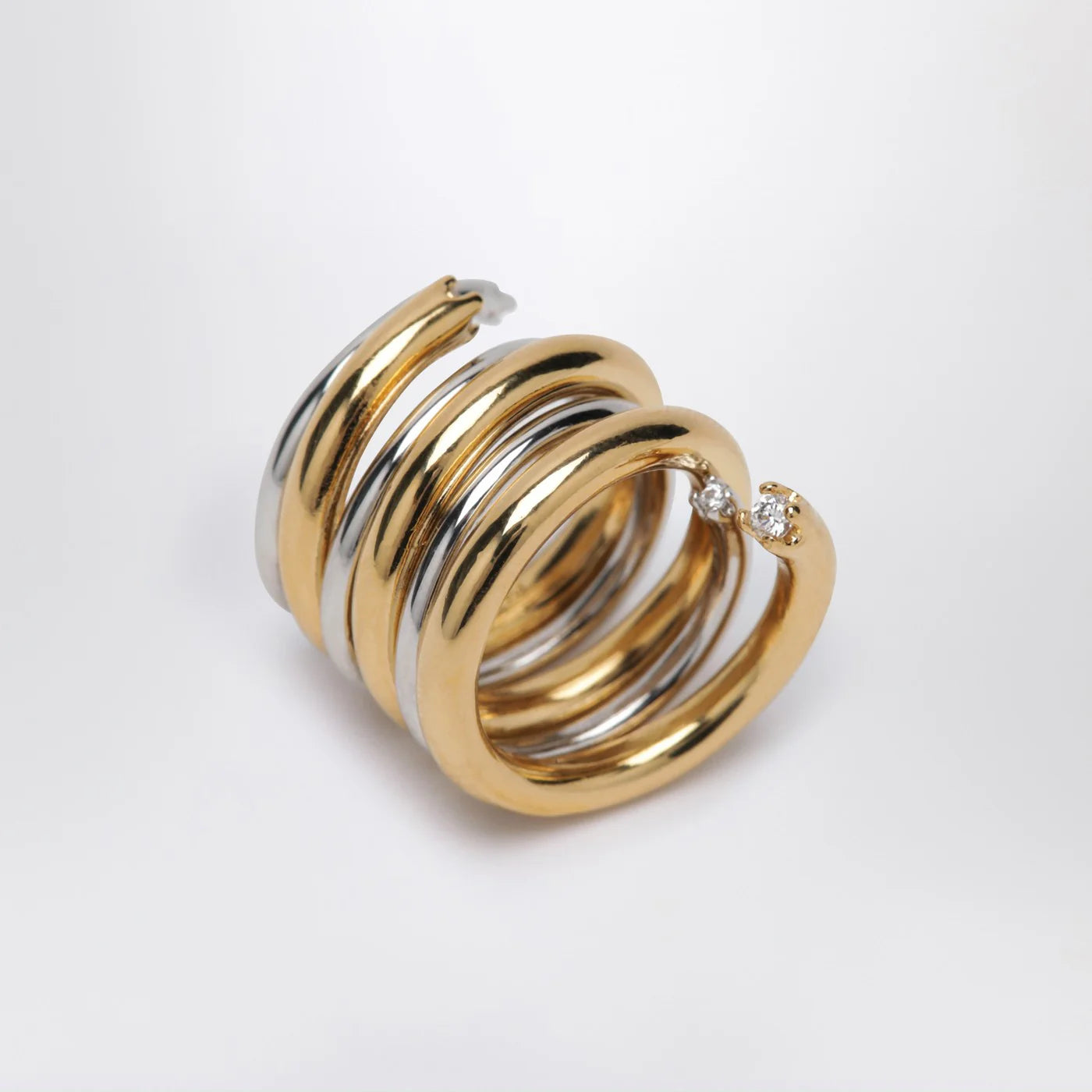 PANCONESI Spiral ring in gold and silver tone