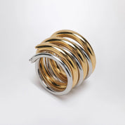 PANCONESI Spiral ring in gold and silver tone
